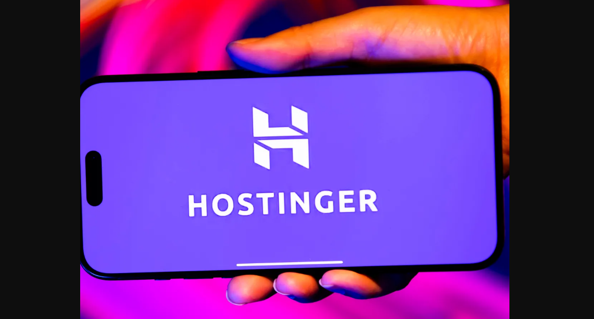 Laptop showing Hostinger dashboard with icons for speed, security, and eco-friendly hosting
