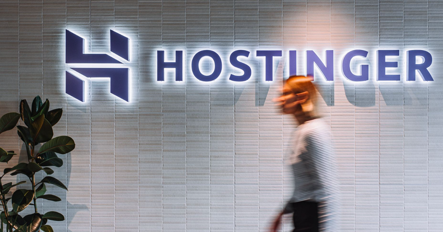 Hostinger homepage open on laptop with discount badges